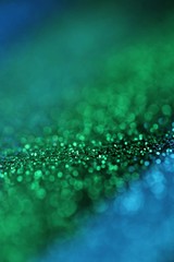 glitter background.blue and Green  gloss layout. Green and blue striped glitter with shining bokeh.Vibrant background with twinkle lights. glitter brilliant mockup