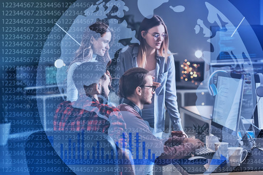 Team of programmers working in office