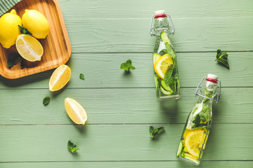 Composition with healthy infused water on wooden background