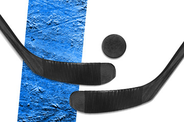 Hockey sticks and puck on a white background with a blue line