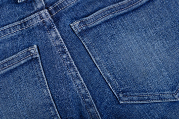 Fototapeta premium Blue cotton jeans texture background with copy space.