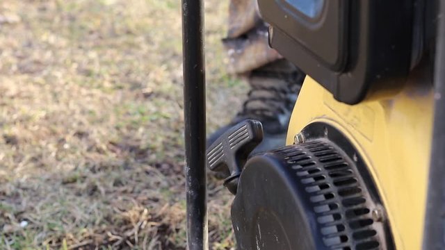 Close-up. The master starts the station through manual start to generate electricity.