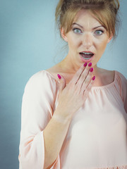 Young woman looking shocked
