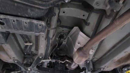 Car lifted on hydraulic lift undercarriage showcase