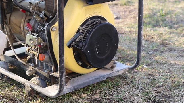 Close-up. The master starts the station through manual start to generate electricity.