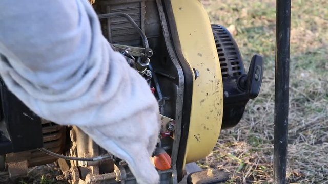 Close-up. The master starts the station through manual start to generate electricity.