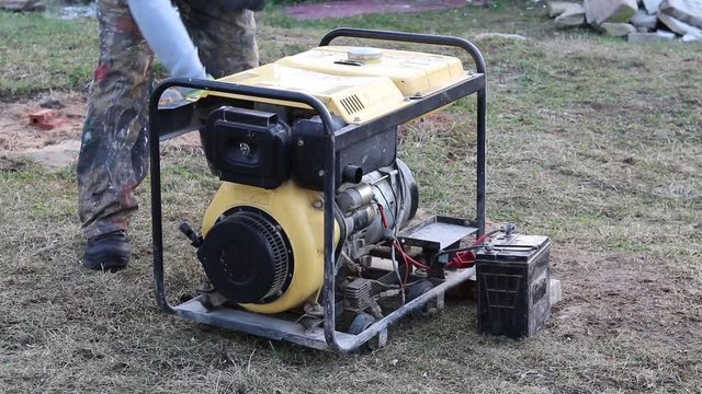 Close-up. The master starts the station through manual start to generate electricity.