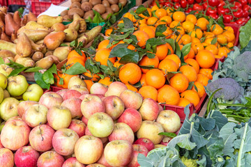 Naklejka na ściany i meble Apples, tangerines and other fruits and vegetables for sale at a market