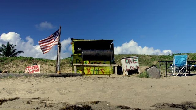 The USA flag moves on a frigate beach in St Kitts
