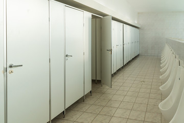 public toilet, with urinals in a bright room