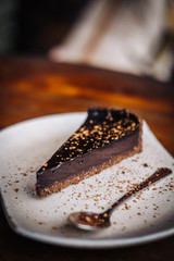 Slice of raw vegan dark chocolate cake