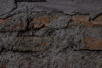 concept and texture of the background - the walls of the house with rough bricks