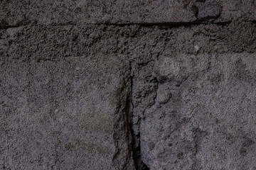 concept and texture of the background - the walls of the house with rough bricks