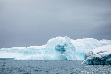 Large icebergs floating in the cold water of Antarctica