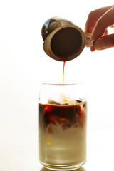 Iced cafe latte, pouring coffee 