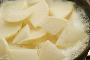 White radish in boiling pot 