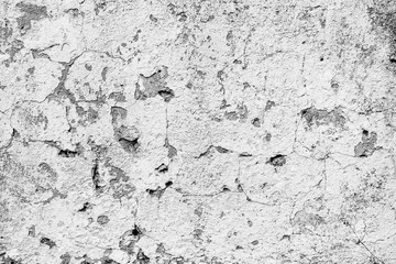 Texture of a concrete wall with cracks and scratches which can be used as a background