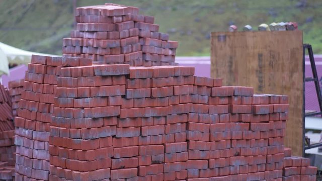 Rudraprayag, Uttarakhand/India- June 21 2019: Tiles Construction work by labor & hard work in progress. Bricks, tiles.