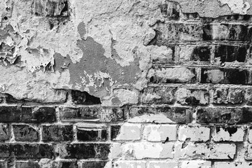 Texture of a brick wall with cracks and scratches which can be used as a background