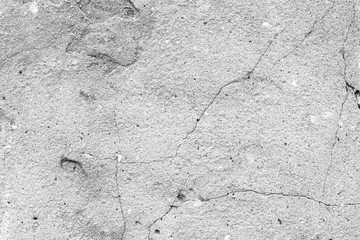 Texture of a concrete wall with cracks and scratches which can be used as a background