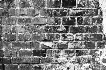 Texture of a brick wall with cracks and scratches which can be used as a background