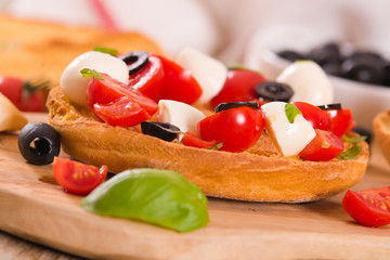 Friselle with tomatoes and mozzarella cheese.