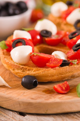 Friselle with tomatoes and mozzarella cheese.