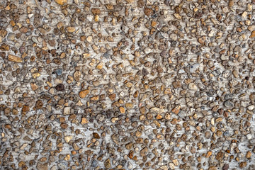 Pattern of gravel at the floor of walkway in Wat Phra That Doi Phra Chan in Mae Tha District using as background