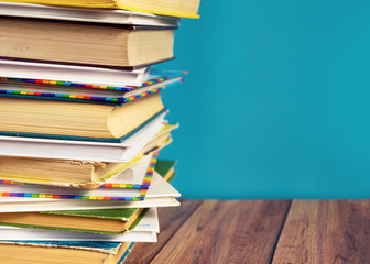 A stack of old books with yellow pages. Book binding. Knowledge and education.