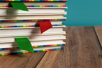 A stack of different bookmarks with bookmarks for pages. Book binding. Knowledge and education. Books for children. School library.