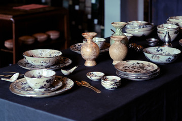 An decorative ceramic dining set in the interior home. Very nicely prepared dinner table.