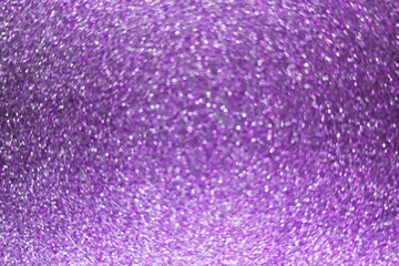 Abstract purple background with bokeh. Bright festive backdrop with blurry sparkles.