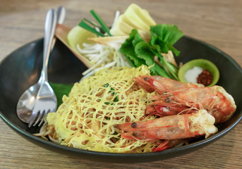 Popular stir-fried rice noodle dish or Pad thai with shrimps , Thailand