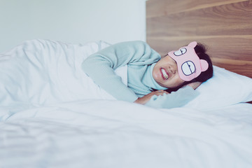 Women sleeping on the bed and grinding teeth,Female tiredness and stress