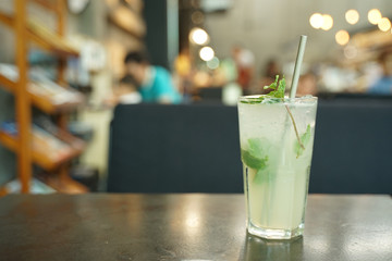 lime soda with fresh lime on clear glass with dark background