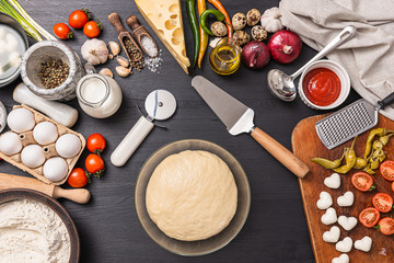 Classic pizza margherita with heart-shaped mazarella cheese. preparing a phased gala dinner for two at home in honor of Valentine's Day.