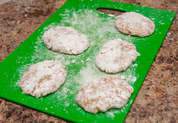 Cutlets on a green board in the kitchen