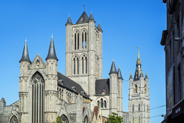 Saint Nicholas' church / Sint-Niklaaskerk and bell tower of the belfry in the old historic city center of Ghent / Gent, East Flanders, Belgium