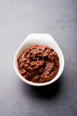 Homemade Tandoori Paste or Marinade mixture, in a bowl. used for grilled chicken or Paneer or vegetable. selective focus