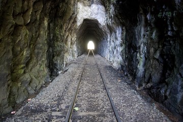 Fototapeta na wymiar Railway road and tunnel in the mountain