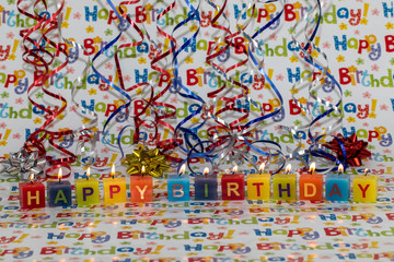 happy birthday with candles and confetti