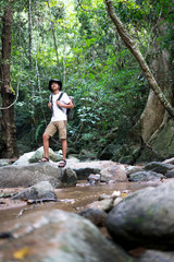 A male hiker hiking in the forest