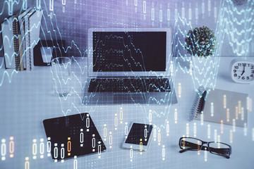 Stock market chart hologram drawn on personal computer background. Multi exposure. Concept of...