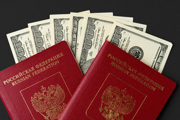 Russian passport with US dollar banknotes inside