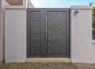 modern house external entrance dark grey metallic door, Athens Greece