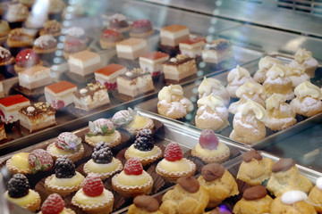 Sweet delicious desserts are on the counter in the market.
