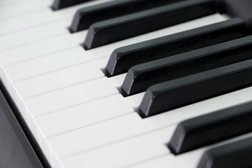 Classical piano keyboard selective focus.Piano keys musical instrument side view.Piano famous...