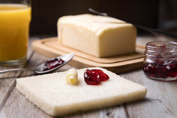 Toast with butter and red fruit jam
