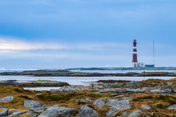 Fototapeta na wymiar lighthouse on coast of sea in Norway