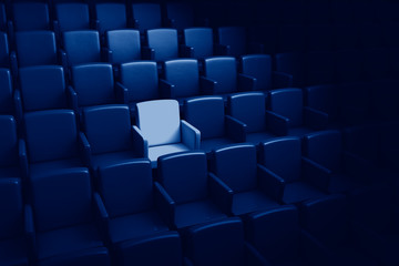 Obraz premium 3D rendering auditorium with one reserved seat toned in trendy Classic Blue color of the Year 2020